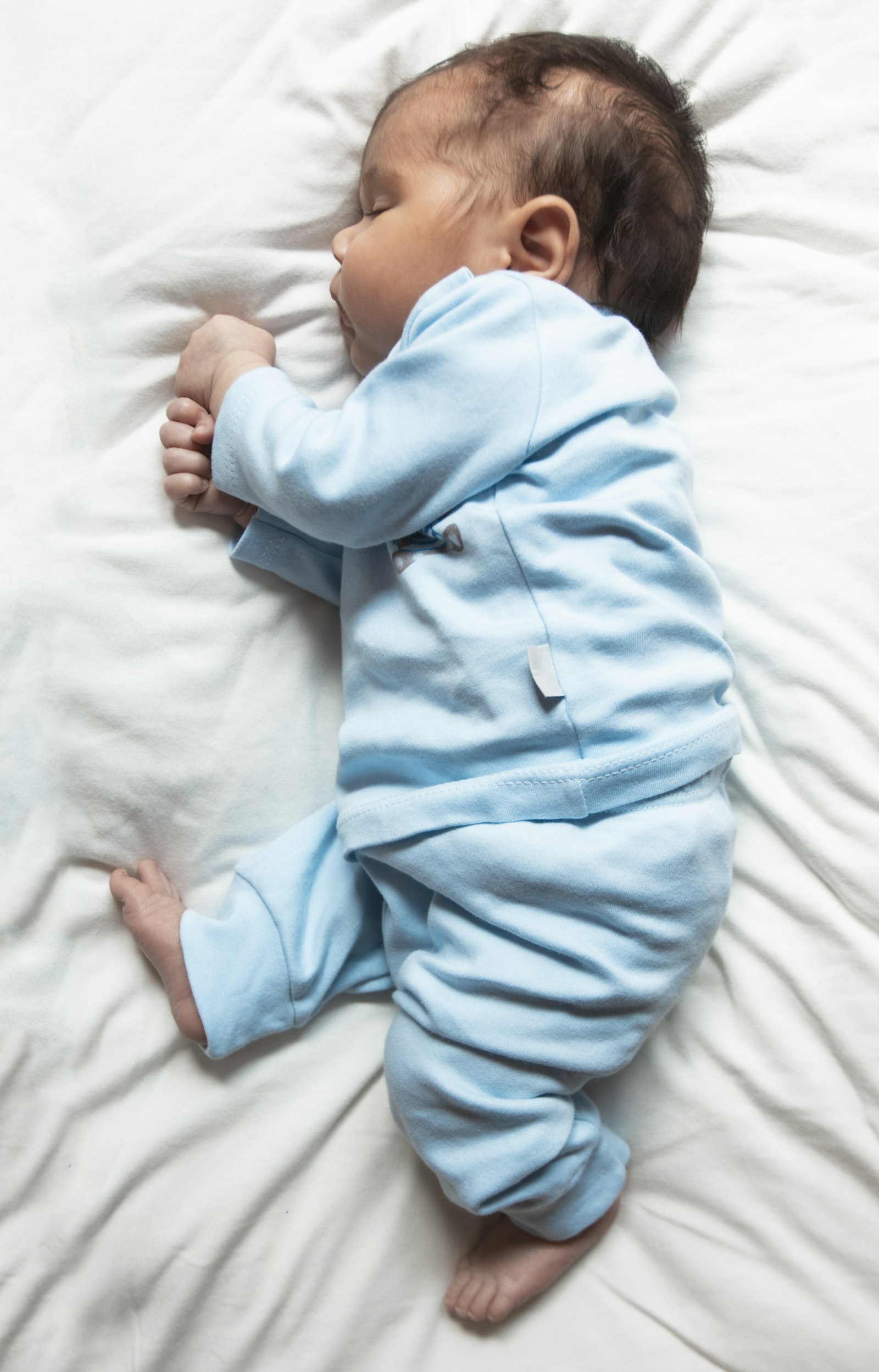 Best Baby Monitor — baby sleeping peacefully in pajamas