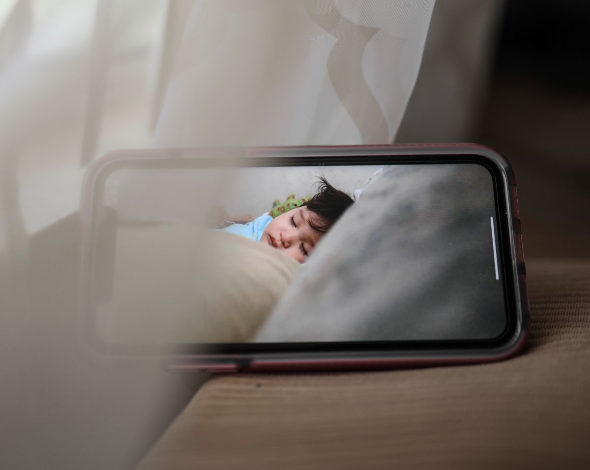 Do you need a baby monitor? A video monitor screen showing a sleeping baby